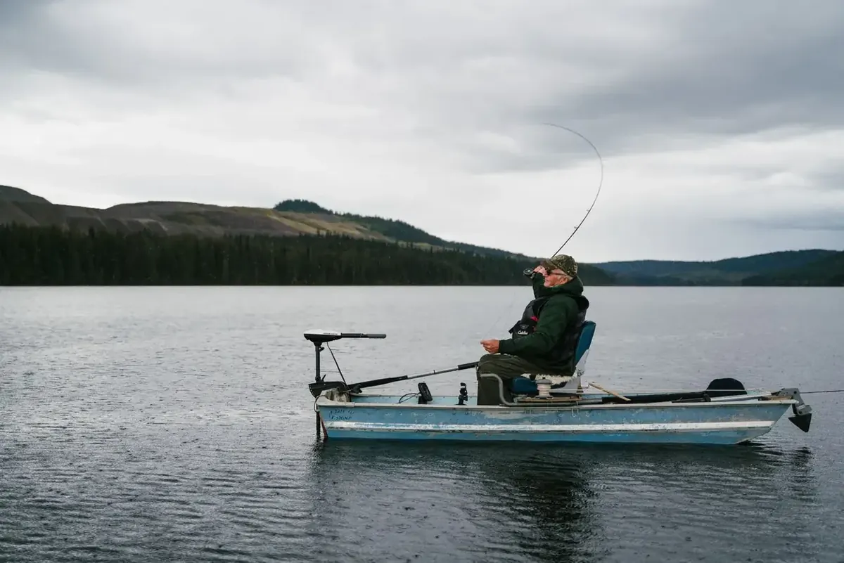Angler seated on a small fishing craft