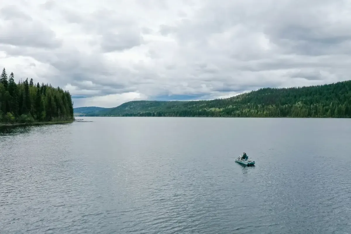 Quiet lake with a small craft
