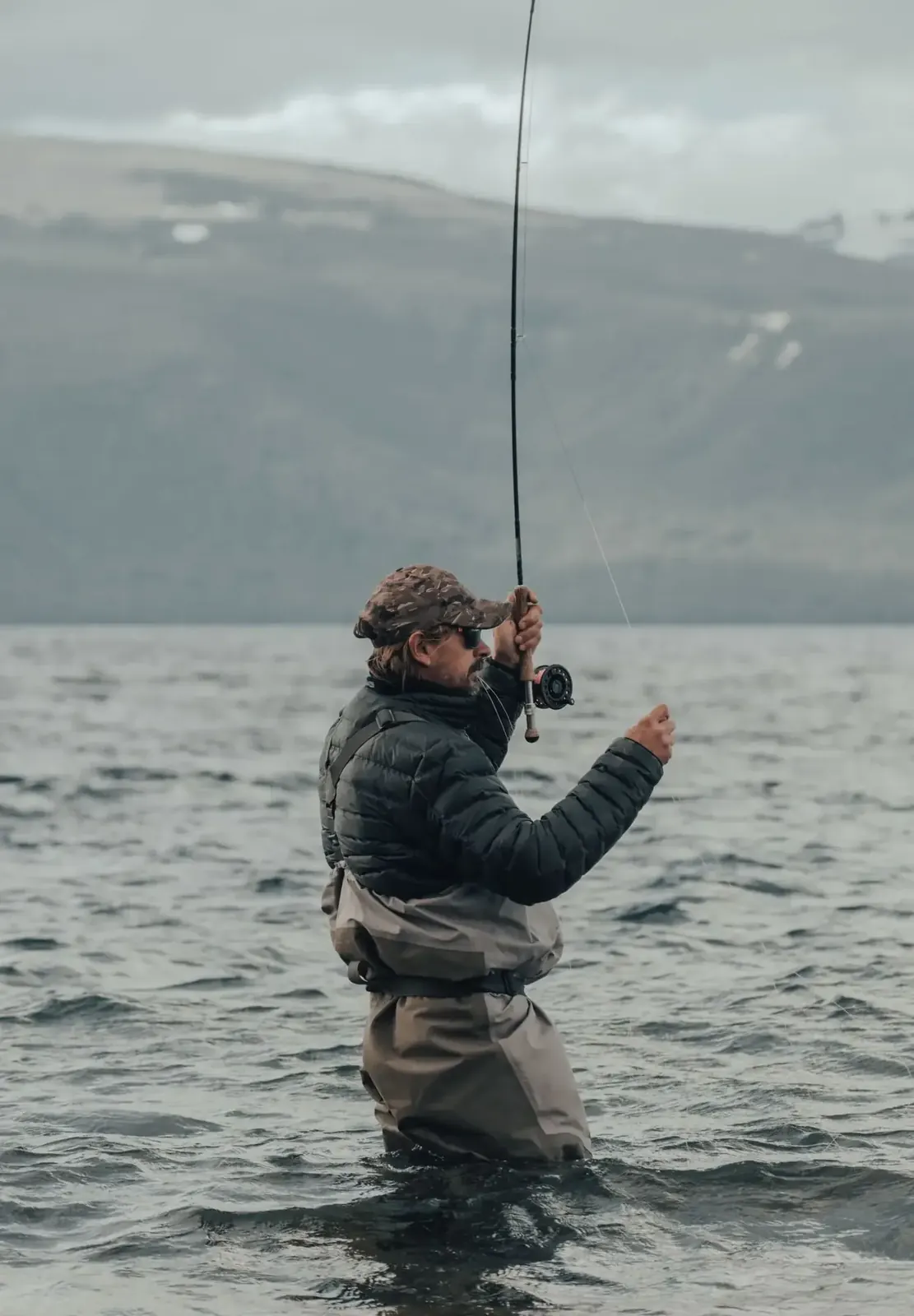 Angler casting on open water